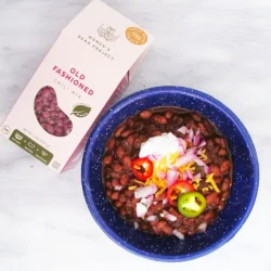 Women's Bean Project old fashioned chili mix next to a bowl of prepared chili