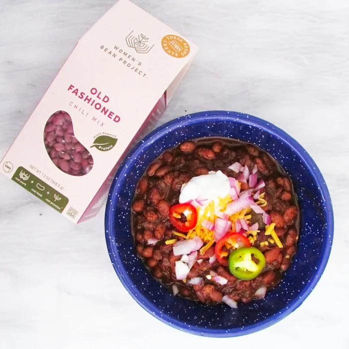 Women's Bean Project old fashioned chili mix next to a bowl of prepared chili